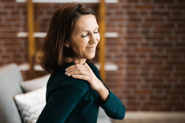 Woman massaging her aching back