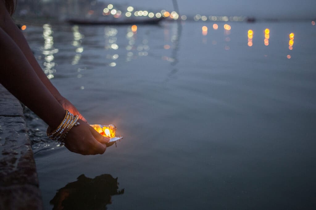 Evening blessing of flowers in river Ganges