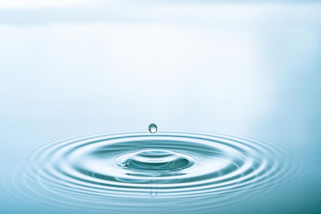 Water Splash of falling drop with circular waves