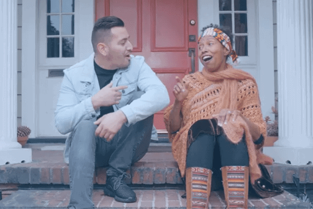 Man and woman visiting while sitting at doorstep
