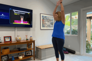 Woman reaches up in exercizes