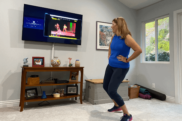 Woman dances with hands on hips