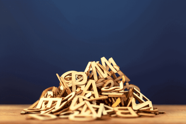 stacked pile of wooden letters