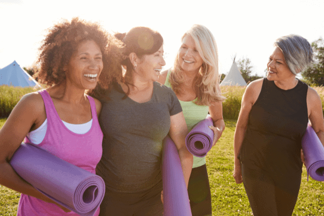 women outdoor yoga class prep