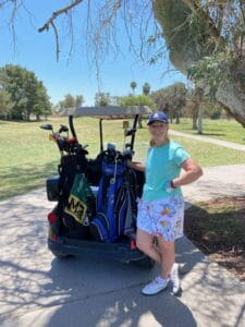 Nancy gets ready to tee off in golf