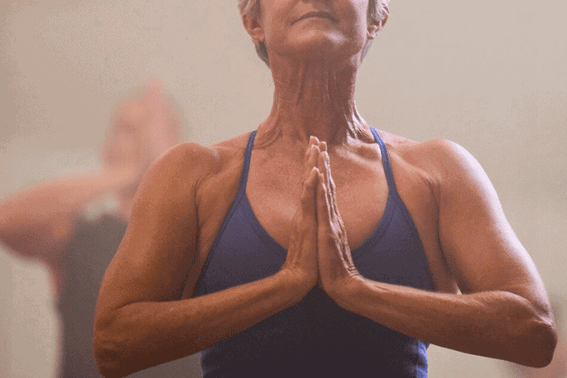 Female in yoga prayer pose