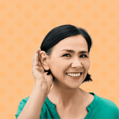 Beautiful woman holding hand to ear to hear