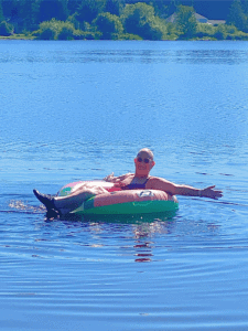 woman on floaty in a lake