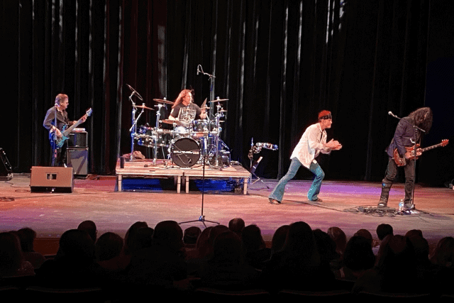 Journey cover band on performance stage